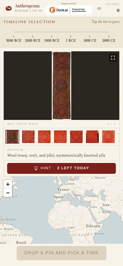 Anthropeum at phone size: a knotted wool carpet with its photo strip, the timeline above, the hint button and the world map below