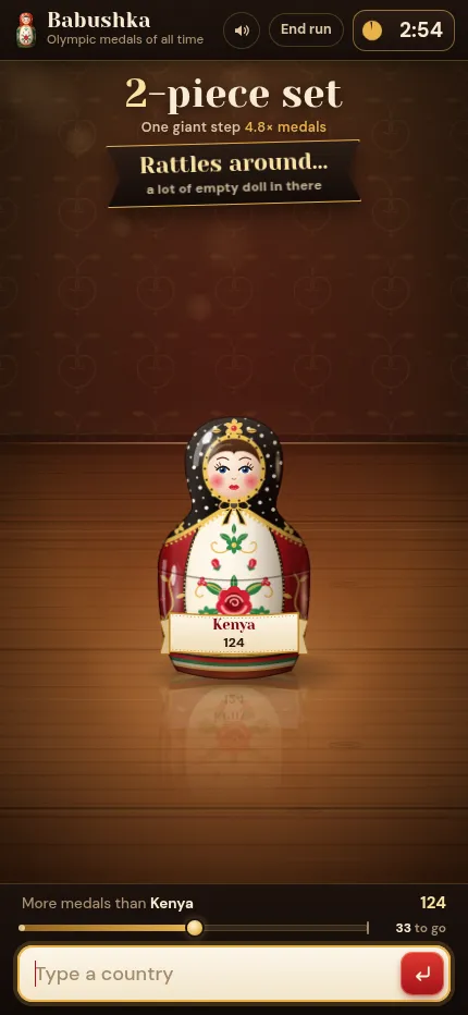 Babushka at phone size on the Olympic medals list: a 2-piece set with a Kenya doll at 124 medals, the progress bar and the country box below