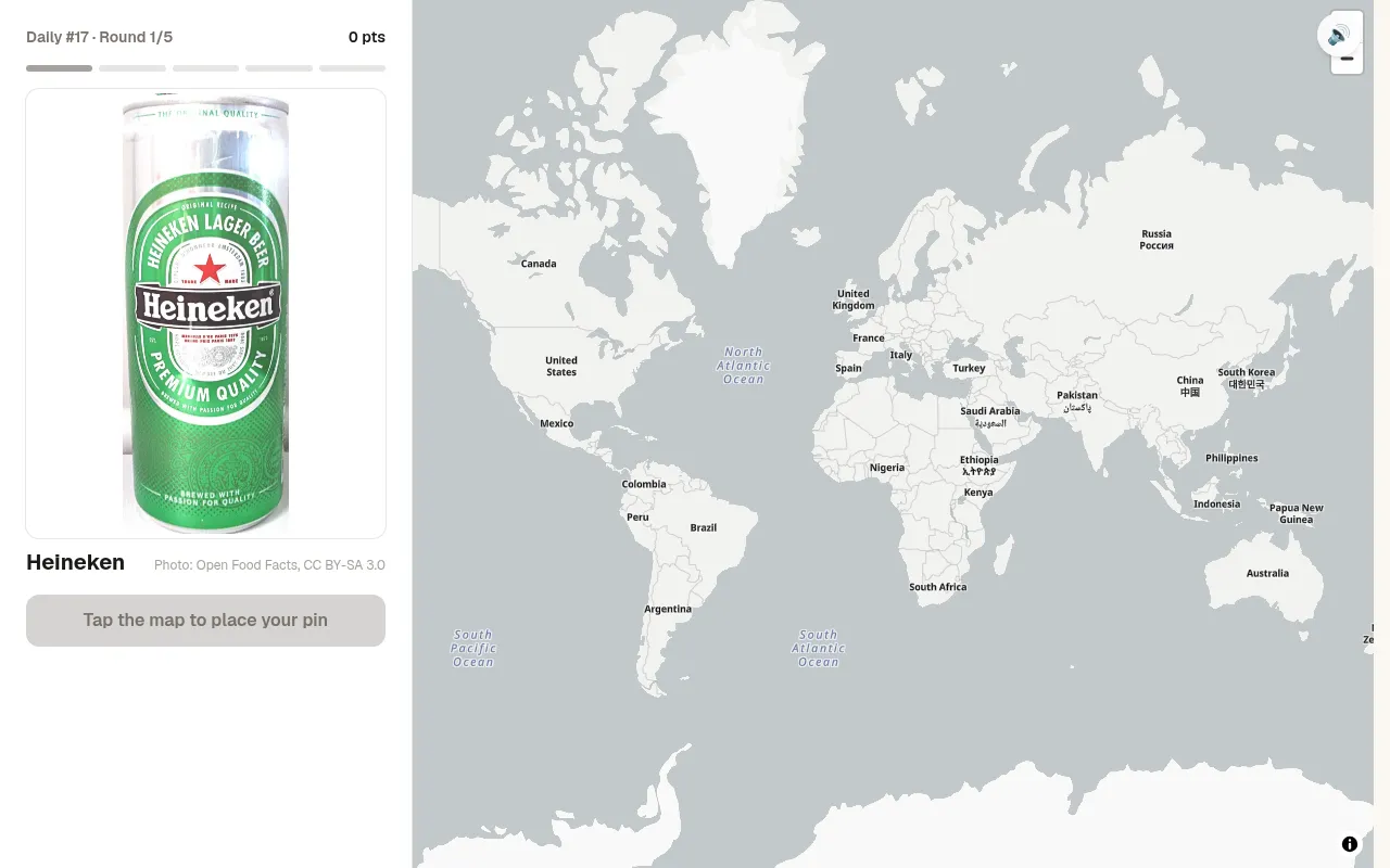 BeerGuessr daily #17, round 1 of 5: a can of Heineken beside a world map waiting for a pin