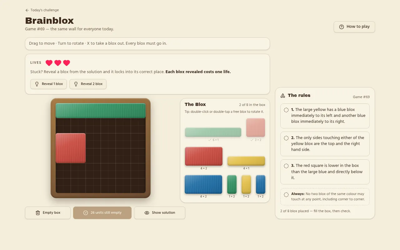 Brainblox Game #69 being played: the green six by one plank and the red square placed in the wooden box, with the day's three rules on the right
