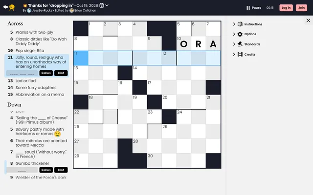 Cross|word for 19 October 2026 on a desktop: a ten by ten midi grid with ORA typed in, Across and Down clues on the left, Rebus and Hint buttons under the chosen clue