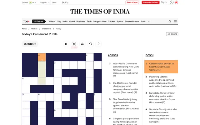 Today's Crossword Puzzle on The Times of India: the grid with its first Down entry highlighted, a timer and help buttons, and Across and Down clues on current affairs