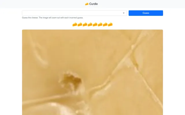 Curdle at the start of a day: the cheese list and Guess button above eight cheese-wedge tries and a tightly zoomed photo of the day's cheese