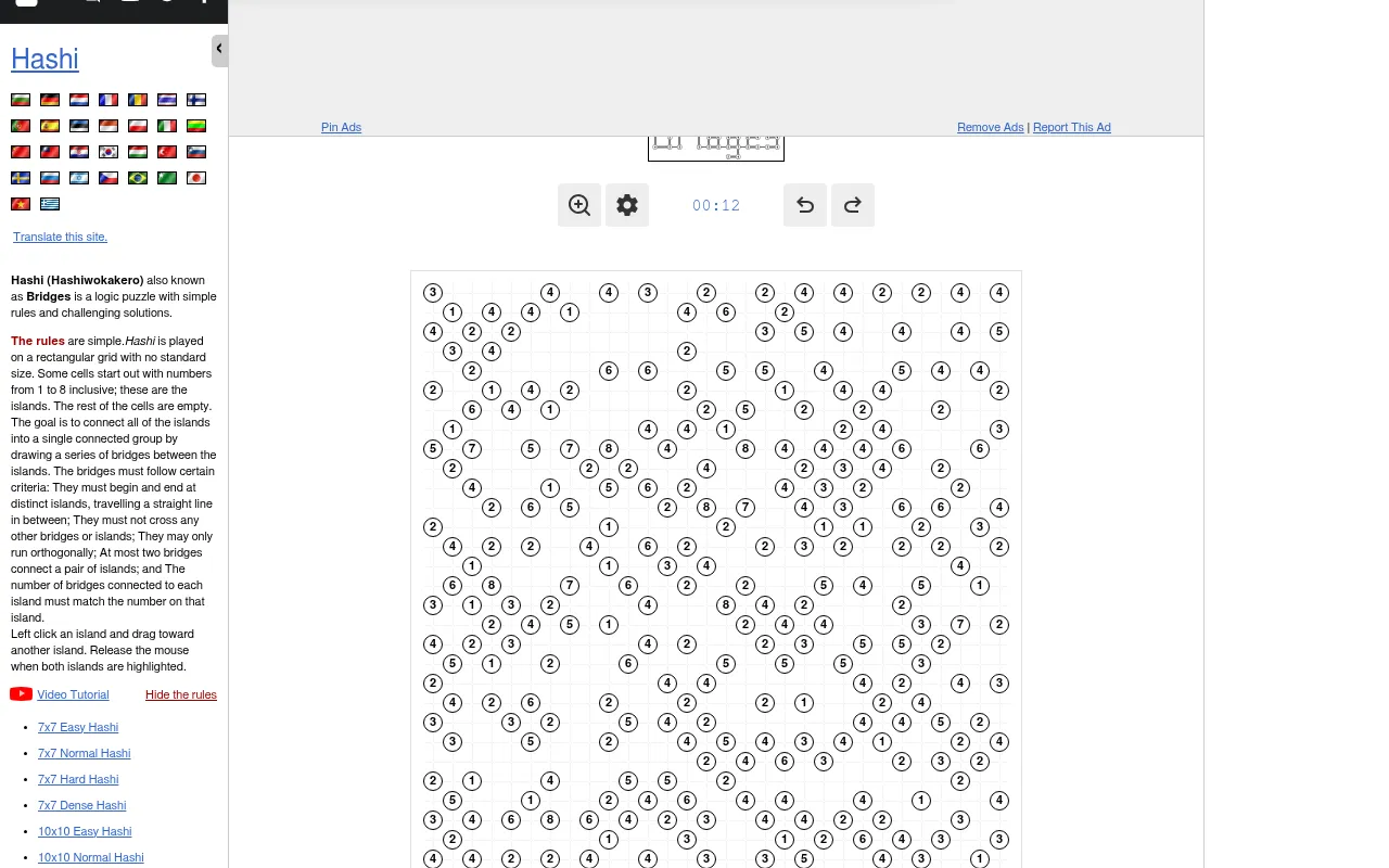 The daily Hashi page on a desktop, with the rules in the left column, the zoom, settings, timer and undo buttons, and the top of the island grid
