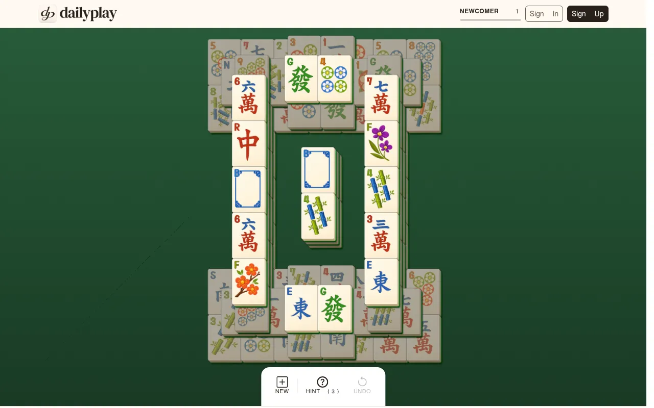 DailyPlay Mahjong daily layout: stacked mahjong solitaire tiles in a ring around a central column on green felt, with New, Hint and Undo buttons
