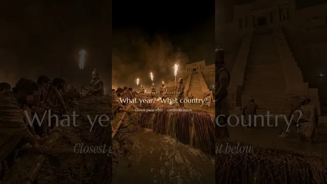 An EraGuessr scene from the maker's YouTube short: torch-lit soldiers by a stepped temple at night, captioned What year? What country?
