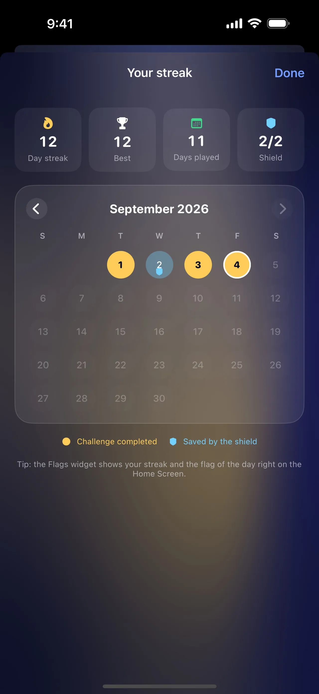 Flags streak screen with a 12 day streak, 11 days played and 2/2 shields over a September 2026 calendar with one day saved by the shield