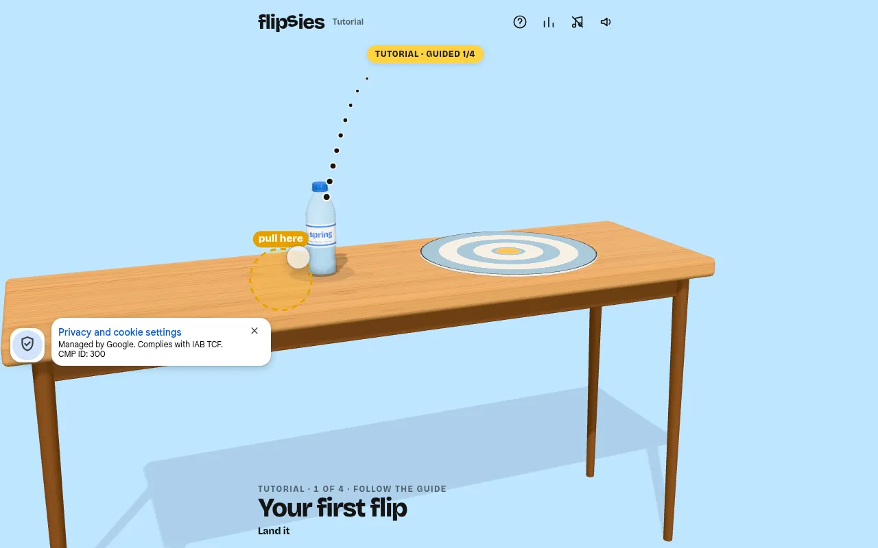 Flipsies board: a water bottle on a wooden table with the dotted throw path and a pull handle, and a round target at the far end