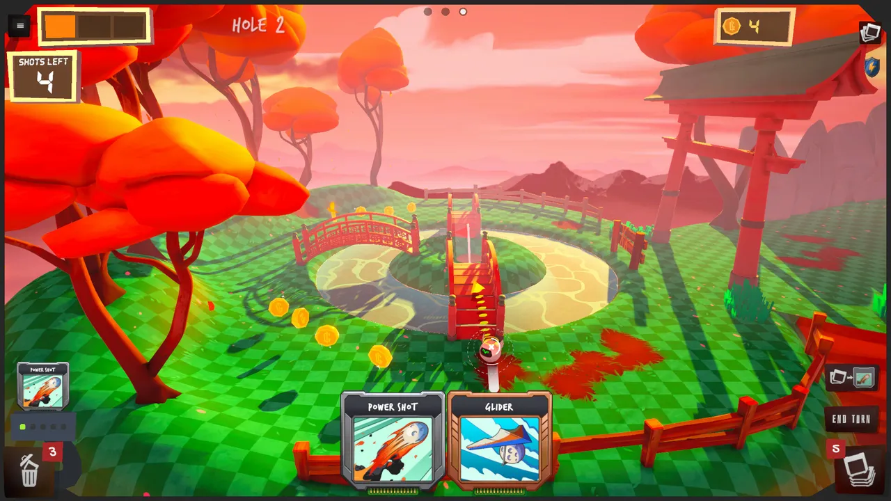 Golfie hole 2 on a Japanese-themed green with red trees and bridges, with Power Shot and Glider cards in hand