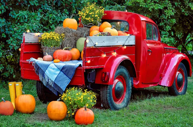 The Daily Jigsaw picture for 3 October 2026: an old red truck among autumn leaves