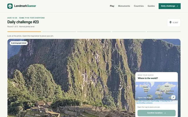 LandmarkGuessr daily challenge #23 of 26 October 2026, round 1 of 5: a cropped photo of mountain ruins with the small world map for placing a pin, score 0 of 5,000