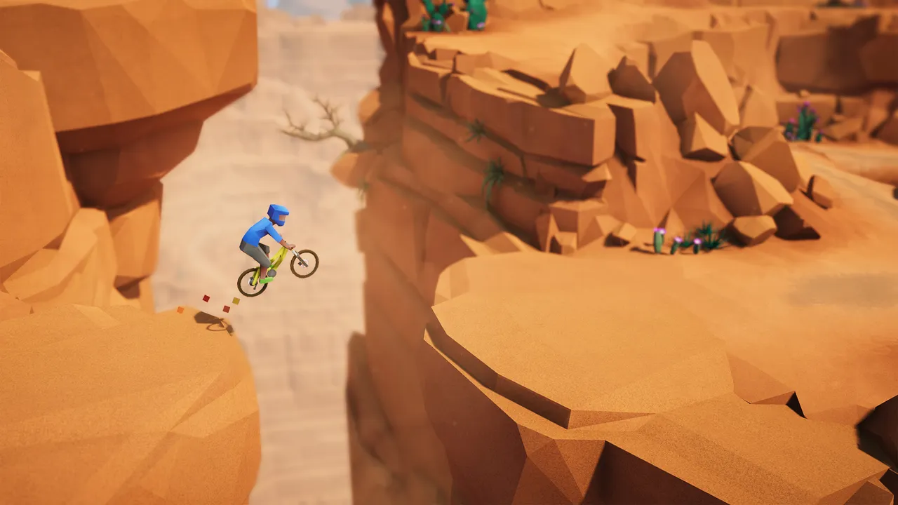 Lonely Mountains: Downhill: a rider in blue jumping a gap between orange low-poly canyon cliffs