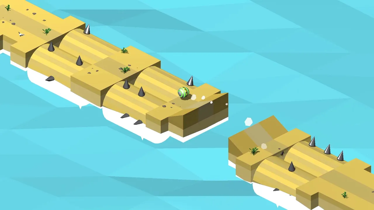 Marble Trap: a green striped marble rolling along a sandy isometric track studded with metal spikes, about to jump a gap over the sea