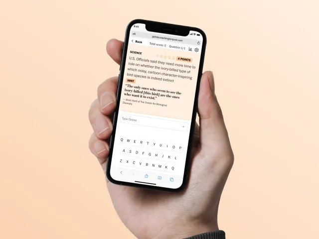 On the Record (The Washington Post) on a phone: a Science question about the ivory-billed woodpecker, a real quote with the bird's name blanked out, a Hint button, 4 points and a Type Guess box