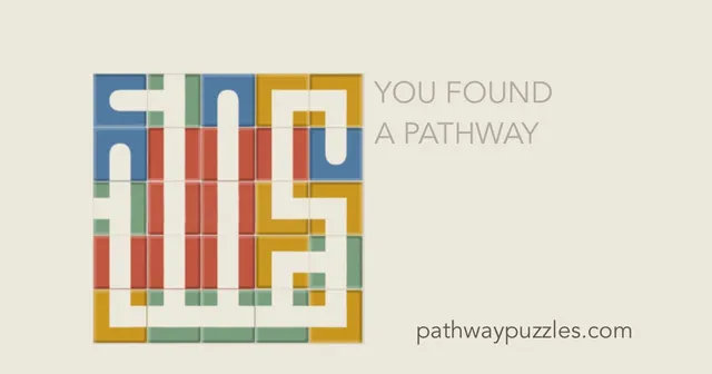 A finished Pathways grid of blue, green, red and yellow path tiles forming one continuous route, beside the words 'You found a pathway'