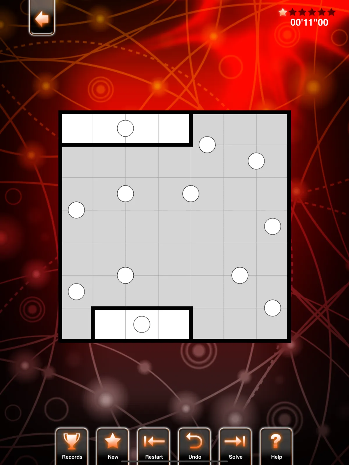 A PuzzleManiak Galaxies board with white circles on a grey grid, partly split into regions