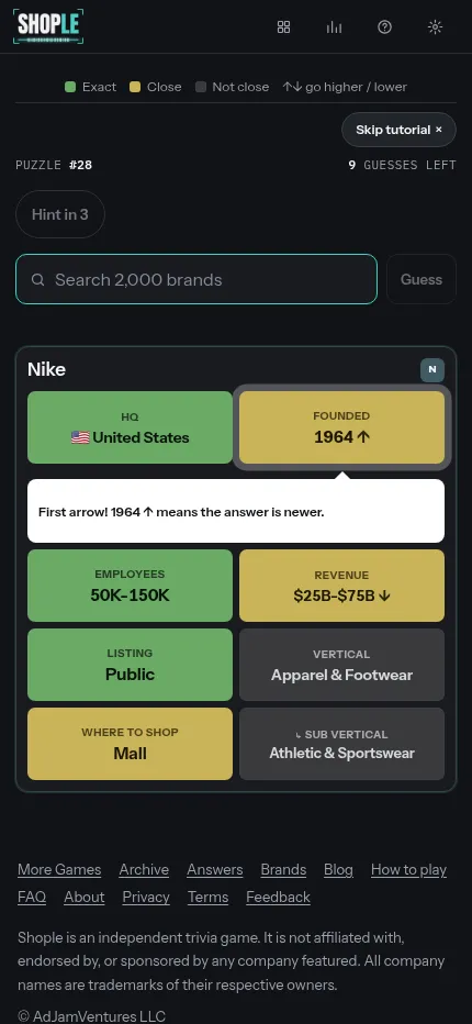 Shople puzzle #28 on a phone: a Nike guess with its eight clue tiles and a tutorial tip explaining the founded arrow