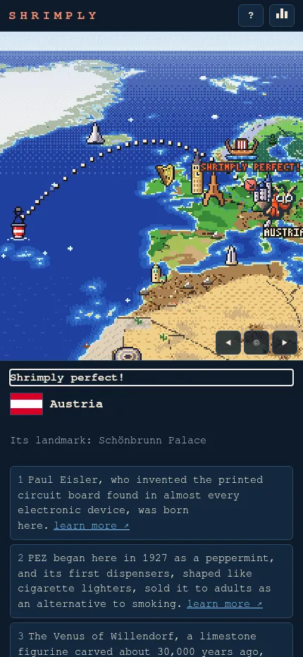 Shrimply solved on a phone: the shrimp on Austria with 'Shrimply perfect!', the Austrian flag, its landmark and the day's clues below the map