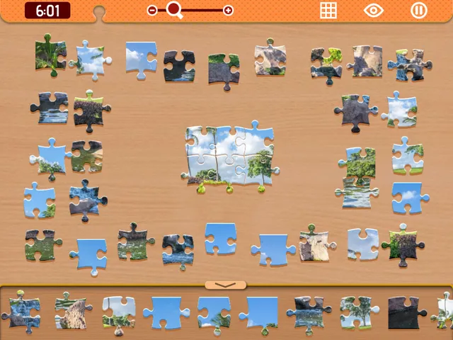 A Daily Jigsaw in progress: loose photo pieces spread on a wooden table around a few joined pieces, with a timer, zoom slider and preview buttons at the top and a piece tray below