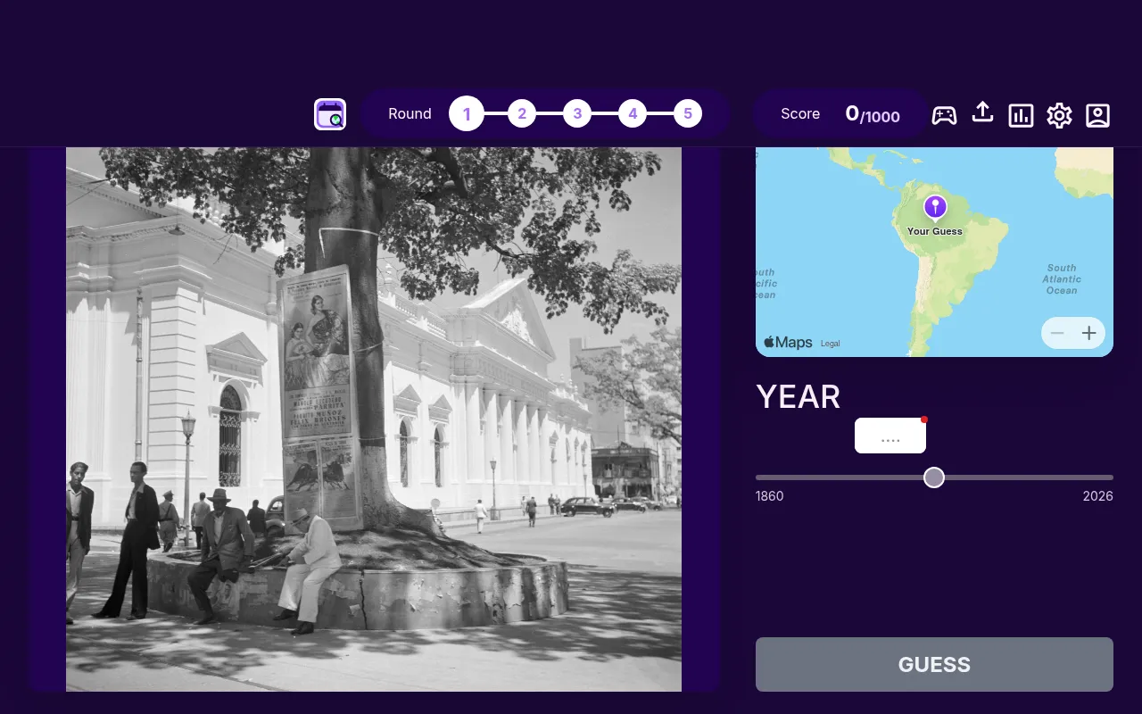 WhenTaken's daily game on 27 October 2026, round 1 of 5: a black and white street photo with a white colonnaded building, a pin on the world map and the 1860 to 2026 year slider