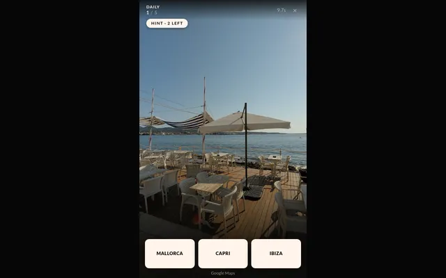 Wild Space Atlas Daily for 29 October 2026, place 1 of 5: a Street View seaside terrace with white chairs and parasols, a hint button (2 left), and three choices: Mallorca, Capri and Ibiza