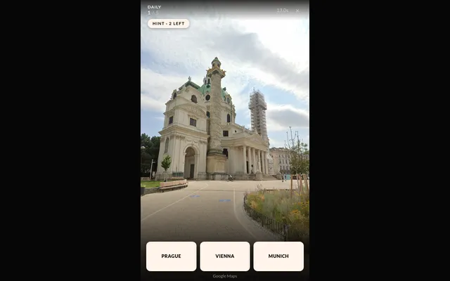 Wild Space Atlas Daily, place 1 of 5: a Street View scene of a baroque domed church on a paved square, a timer and a hint button (2 left) above, and three city choices below: Prague, Vienna and Munich